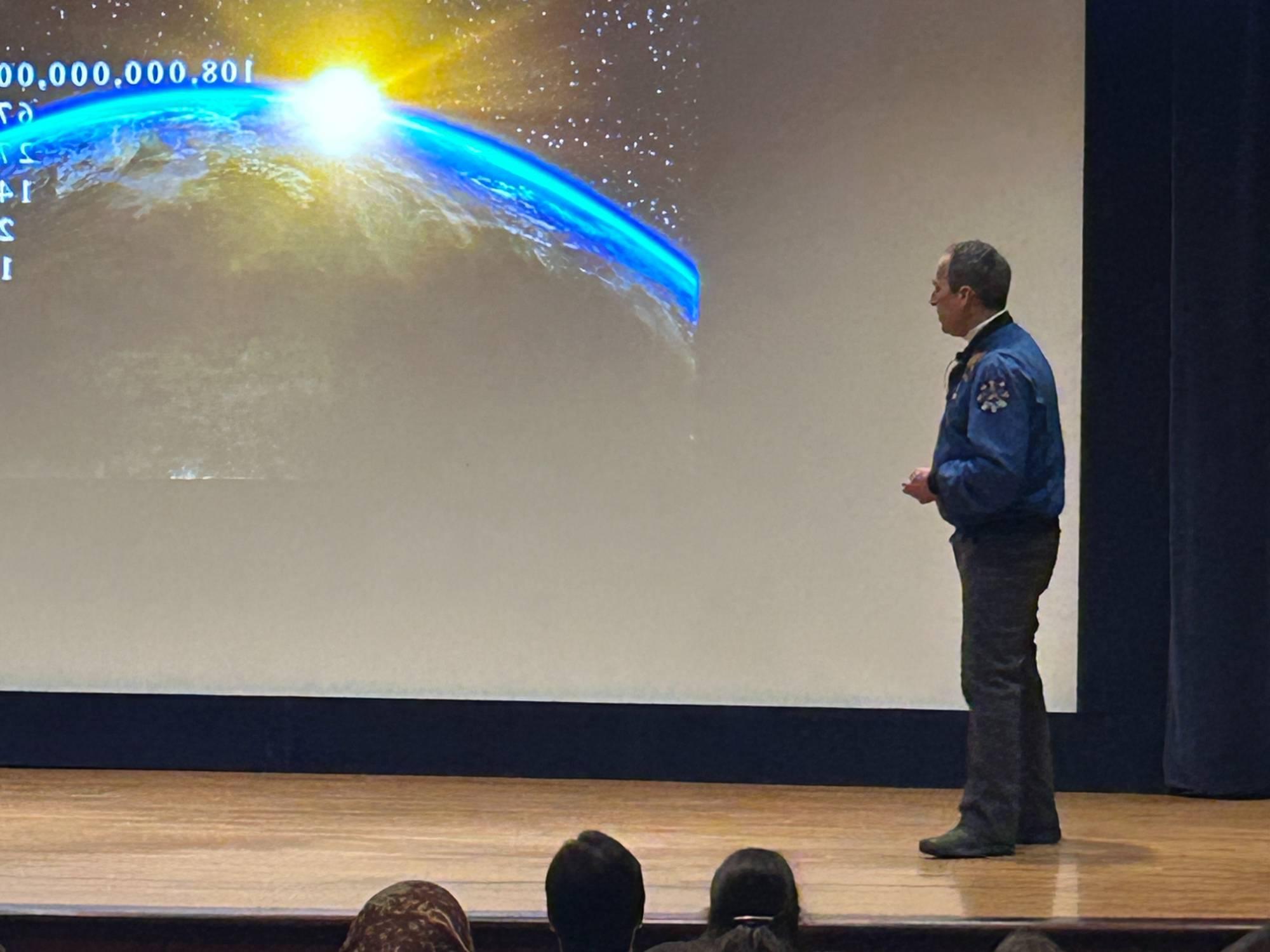 Astronaut John Herrington presenting at the Loosemore Auditorium